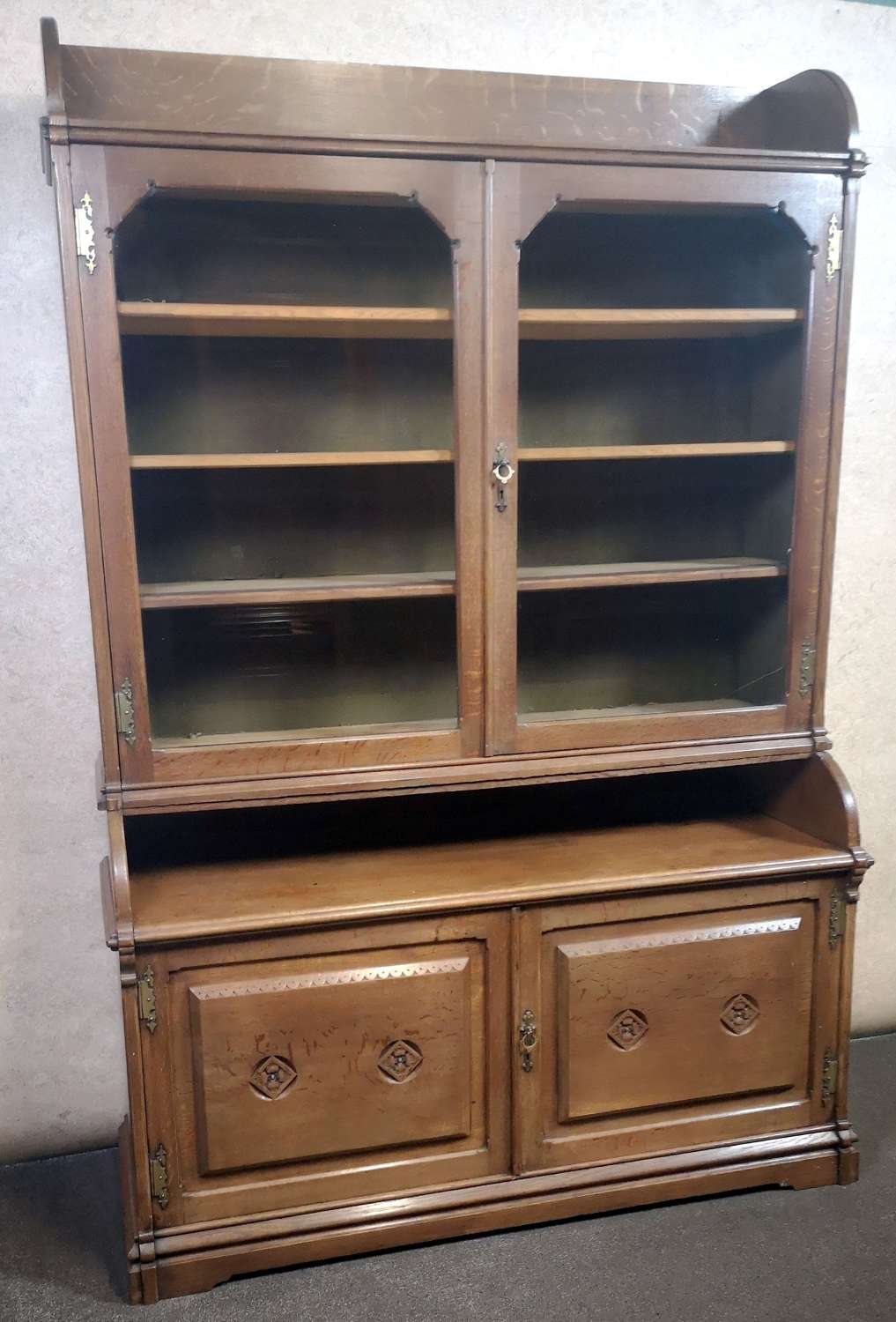 OAK ARTS AND CRAFTS BOOKCASE IN THE GOTHIC STYLE