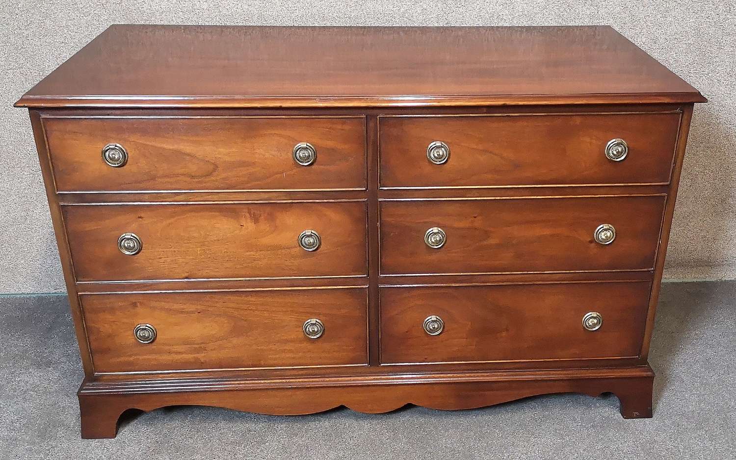 A Reprodux Bevan Funnell Figured Mahogany Chest of Drawers
