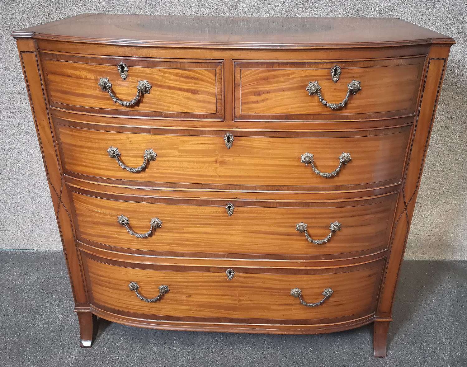 EDWARDIAN INLAID SATINWOOD BOW FRONTED CHEST OF DRAWERS