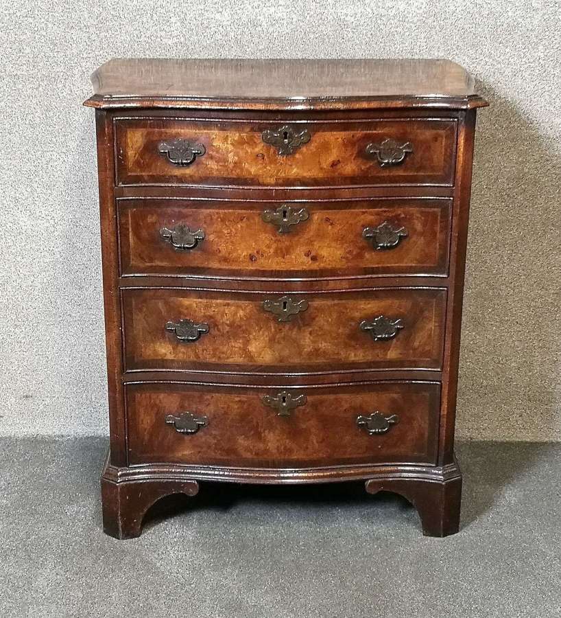 An 18th Century Style Figured Walnut Serpentine Chest of Drawers