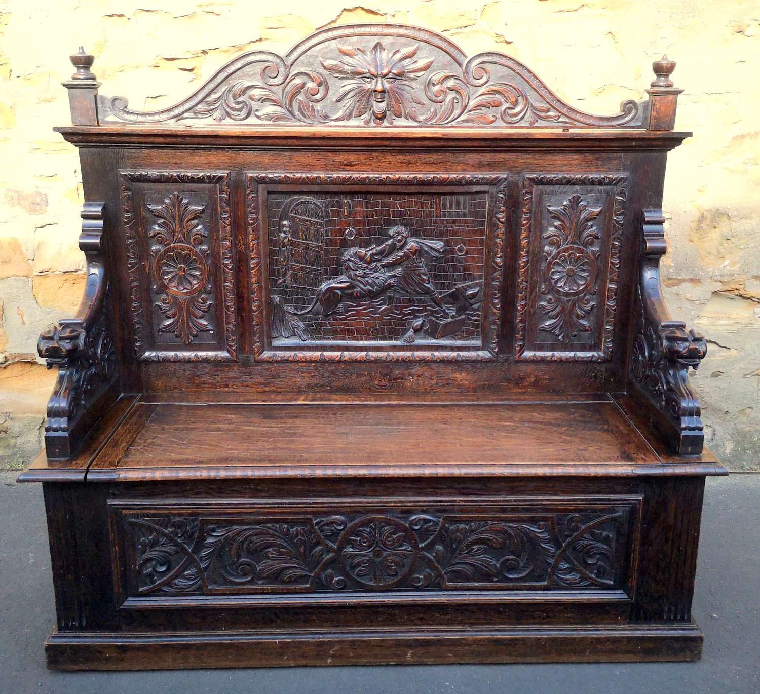 A Victorian Carved Oak Box Settle
