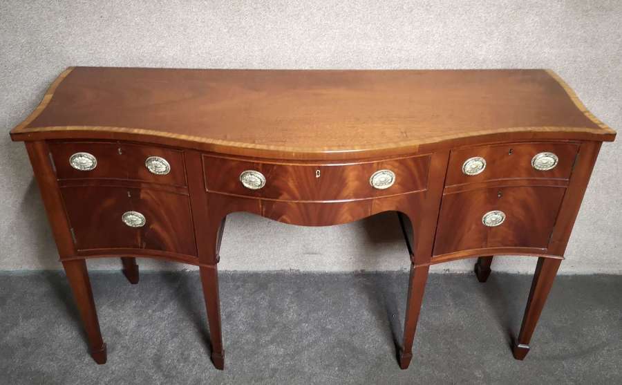 A William Tillman Mahogany and Satinwood Banded Serpentine Sideboard